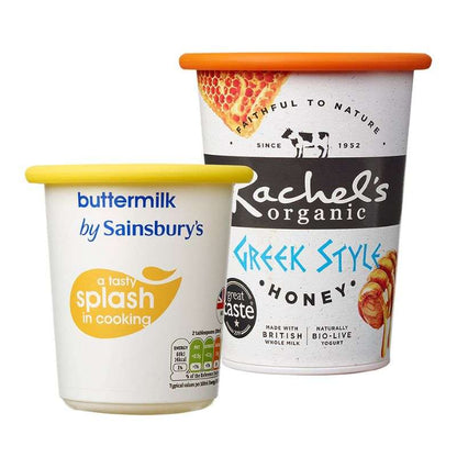 Two containers of yogurt from Sainsbury's and Rachel's Organic on a white background